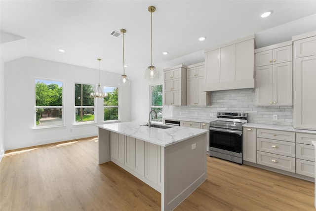 2915 NW Loraine St, Fort Worth, TX 76106 - kitchen with stainless steel electric range oven, a sink, custom range hood, plenty of natural light, and recessed lighting
