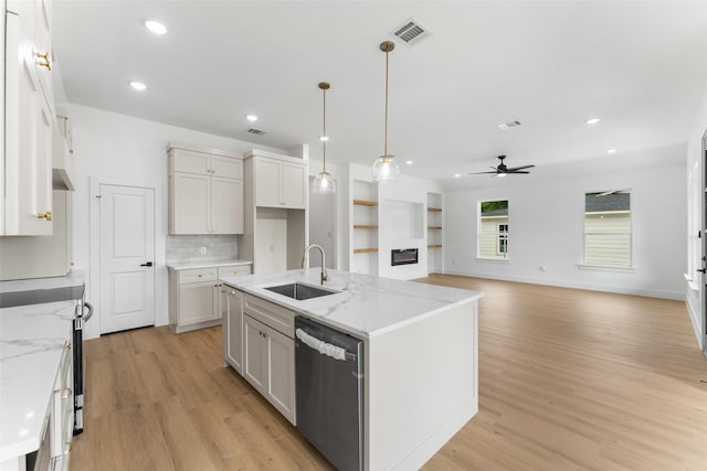 2915 NW Loraine St, Fort Worth, TX 76106 - kitchen with stainless steel dishwasher, a sink, a ceiling fan, light wood-style flooring, and electric range oven