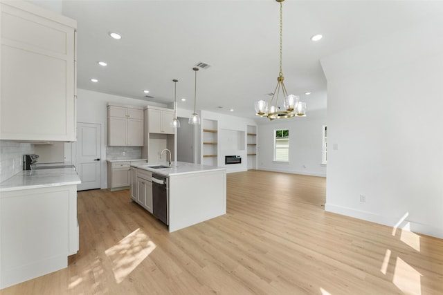 2915 NW Loraine St, Fort Worth, TX 76106 - kitchen featuring stainless steel appliances, a sink, a chandelier, decorative backsplash, and recessed lighting