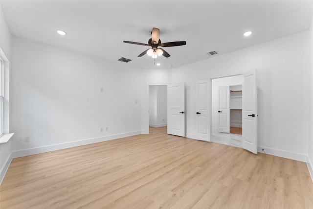 2915 NW Loraine St, Fort Worth, TX 76106 - unfurnished bedroom featuring light wood finished floors, recessed lighting, baseboards, a ceiling fan, and a spacious closet