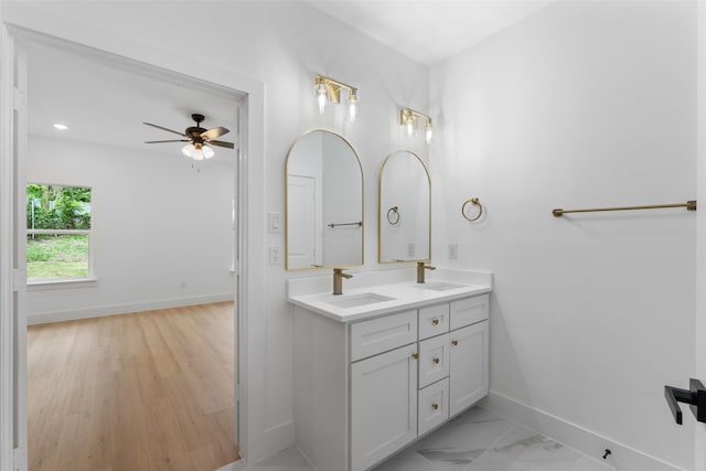 2915 NW Loraine St, Fort Worth, TX 76106 - bathroom with baseboards, a ceiling fan, and double vanity