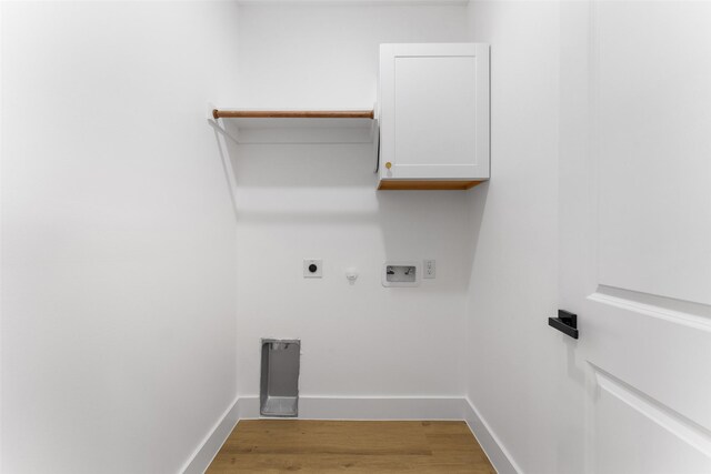 2915 NW Loraine St, Fort Worth, TX 76106 - laundry area featuring cabinet space, hookup for an electric dryer, washer hookup, light wood finished floors, and gas dryer hookup