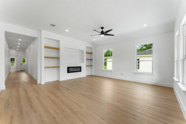 2915 NW Loraine St, Fort Worth, TX 76106 - unfurnished living room featuring baseboards, light wood finished floors, plenty of natural light, and recessed lighting
