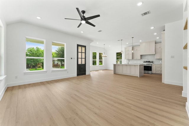 2915 NW Loraine St, Fort Worth, TX 76106 - unfurnished living room with a ceiling fan, light wood finished floors, recessed lighting, a sink, and baseboards