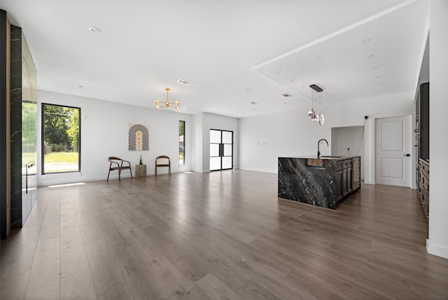 2535 Exline St, Dallas, TX 75215 - living room with a chandelier, dark wood finished floors, and baseboards