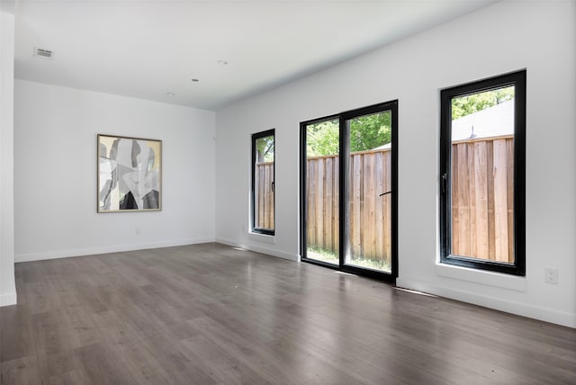 2535 Exline St, Dallas, TX 75215 - empty room featuring wood finished floors and baseboards