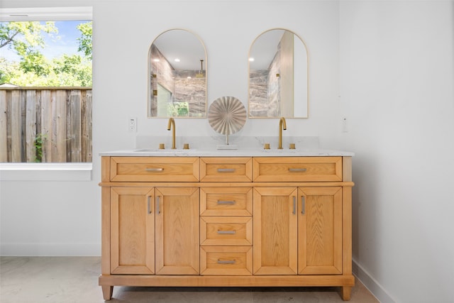 2535 Exline St, Dallas, TX 75215 - bathroom with baseboards and double vanity