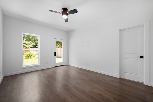 2535 Exline St, Dallas, TX 75215 - unfurnished room with dark wood-style flooring, ceiling fan, and baseboards