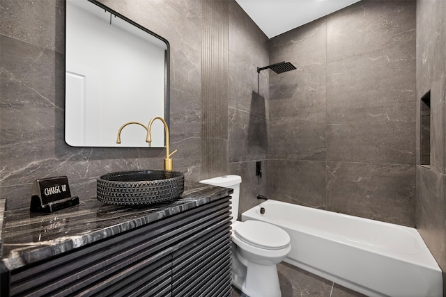 2535 Exline St, Dallas, TX 75215 - bathroom featuring toilet, tile walls, shower / bathtub combination, and vanity