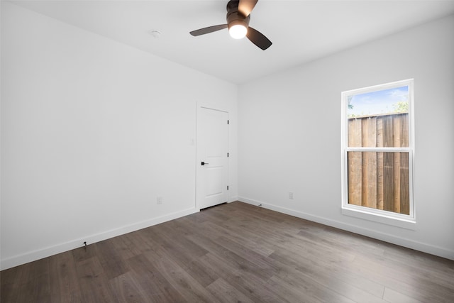 2535 Exline St, Dallas, TX 75215 - spare room featuring dark wood-style floors, ceiling fan, and baseboards