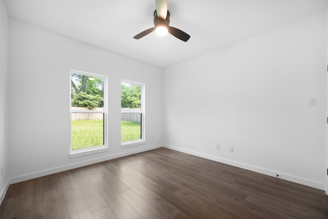 2535 Exline St, Dallas, TX 75215 - spare room with dark wood-style flooring, ceiling fan, and baseboards