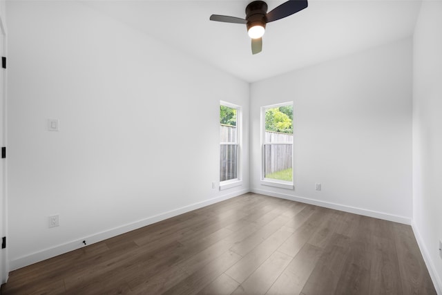 2535 Exline St, Dallas, TX 75215 - spare room with dark wood-style flooring, a ceiling fan, and baseboards
