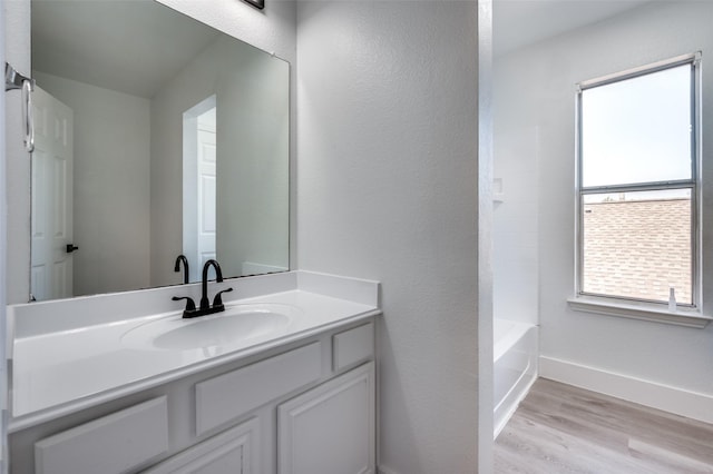 9316 Norfolk Ln, Mckinney, TX 75071 - bathroom with wood finished floors, baseboards, and vanity