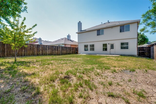 9316 Norfolk Ln, Mckinney, TX 75071 - back of house featuring a chimney