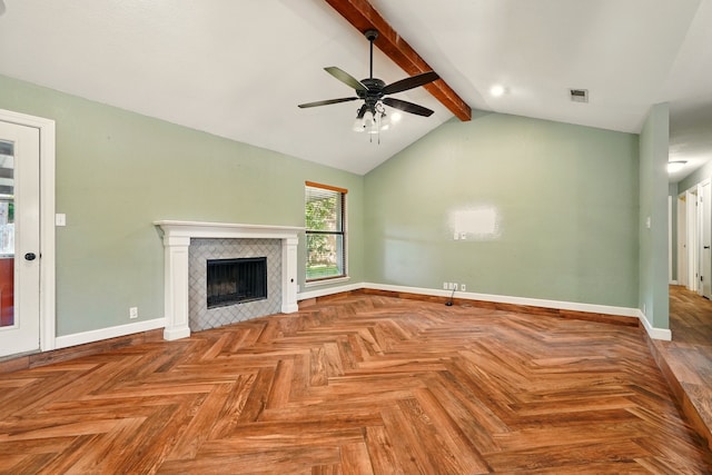 unfurnished living room featuring a ceiling fan, baseboards, and a tile fireplace