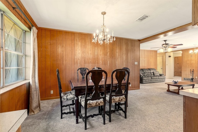 303 Luby Dr, Tom Bean, TX 75489 - dining space with carpet floors, a chandelier, wooden walls, and healthy amount of natural light