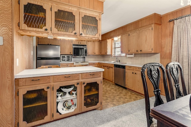 303 Luby Dr, Tom Bean, TX 75489 - kitchen with stainless steel appliances, a sink, light countertops, tasteful backsplash, and glass insert cabinets