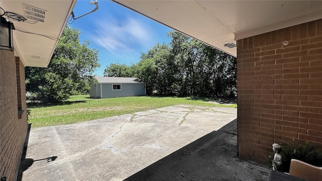 303 Luby Dr, Tom Bean, TX 75489 - view of patio with an outbuilding