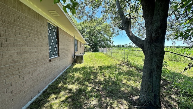 303 Luby Dr, Tom Bean, TX 75489 - view of yard featuring central AC