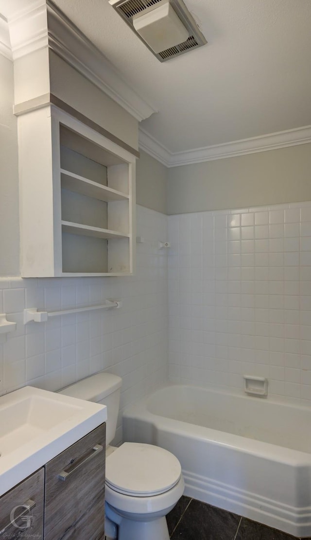 full bathroom with crown molding, tile walls, tile patterned floors, toilet, and vanity