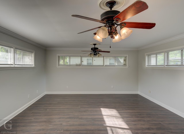 spare room with crown molding, ceiling fan, dark wood finished floors, and baseboards