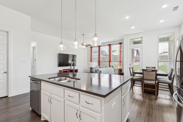 1654 Castleford Dr, Forney, TX 75126 - kitchen featuring a sink, dark countertops, stainless steel appliances, dark wood-type flooring, and pendant lighting