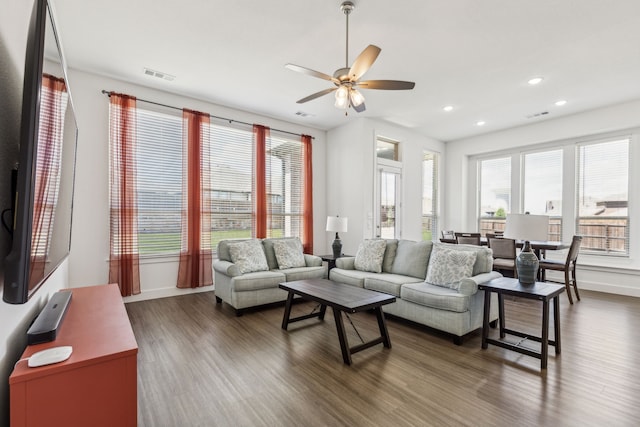 1654 Castleford Dr, Forney, TX 75126 - living area featuring dark wood-style flooring, recessed lighting, healthy amount of natural light, ceiling fan, and baseboards