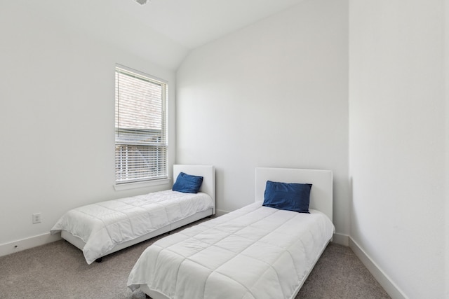 1654 Castleford Dr, Forney, TX 75126 - carpeted bedroom with baseboards and lofted ceiling