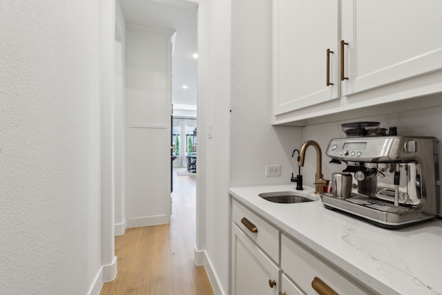 1421 Maplewood Dr, Prosper, TX 75078 - bar with a sink, light wood finished floors, baseboards, and a textured wall
