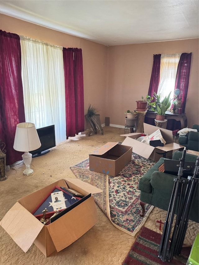 2414 Marfa Ave, Dallas, TX 75216 - carpeted living room featuring baseboards