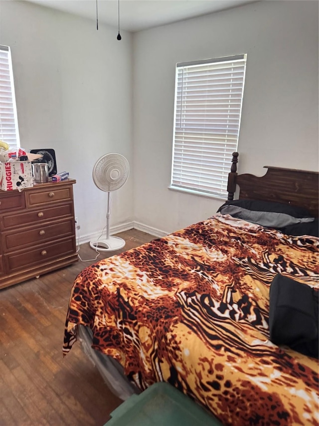 2414 Marfa Ave, Dallas, TX 75216 - bedroom with dark wood-style flooring and baseboards