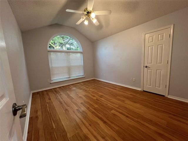 920 Joshua Dr, Burleson, TX 76028 - spare room featuring wood finished floors, vaulted ceiling, ceiling fan, a textured ceiling, and baseboards