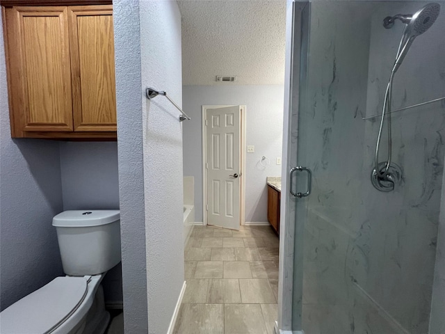 920 Joshua Dr, Burleson, TX 76028 - full bathroom featuring a marble finish shower, toilet, vanity, a textured ceiling, and baseboards