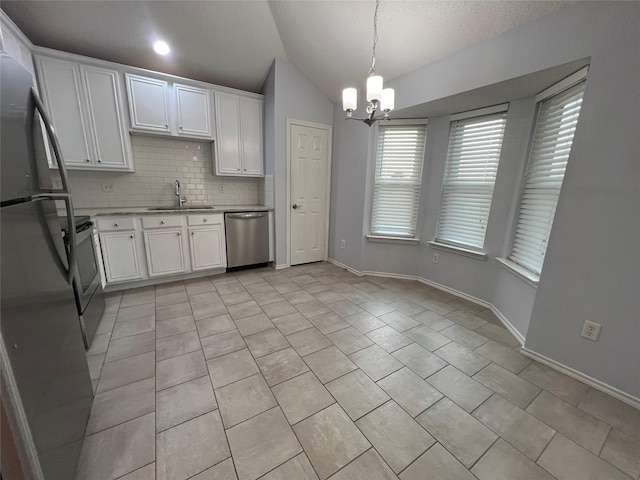 920 Joshua Dr, Burleson, TX 76028 - kitchen with dishwasher, freestanding refrigerator, a sink, a chandelier, and vaulted ceiling