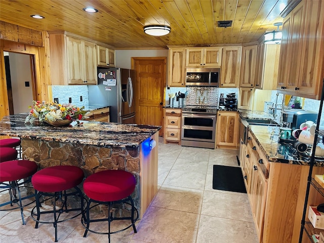 637 County Road 4420, Winnsboro, TX 75494 - kitchen with appliances with stainless steel finishes, backsplash, dark stone counters, wooden ceiling, and a peninsula