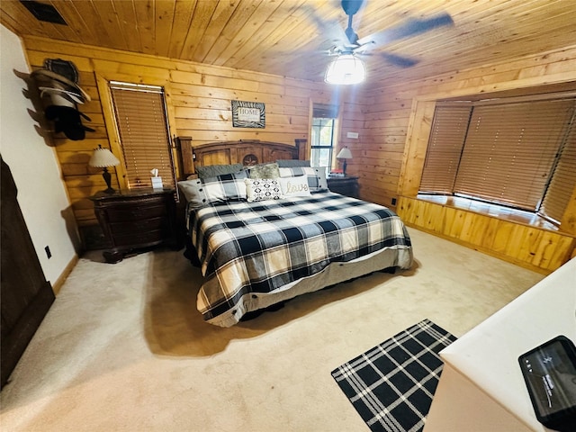 637 County Road 4420, Winnsboro, TX 75494 - carpeted bedroom with wood walls, wood ceiling, and ceiling fan