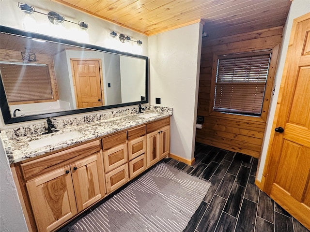 637 County Road 4420, Winnsboro, TX 75494 - full bath featuring wood tiled floors, double vanity, baseboards, wood ceiling, and crown molding