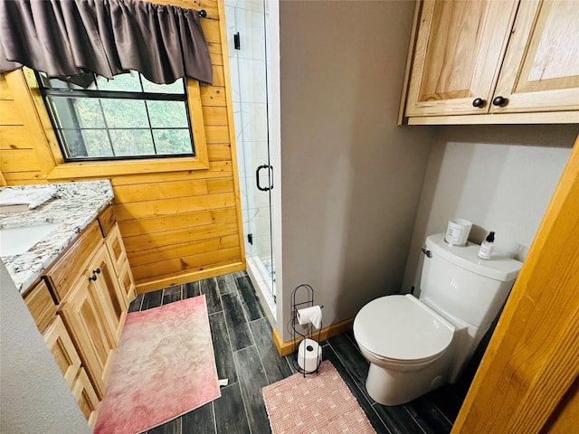 637 County Road 4420, Winnsboro, TX 75494 - full bath with a shower stall, wood finish floors, toilet, vanity, and baseboards