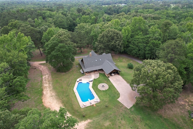 637 County Road 4420, Winnsboro, TX 75494 - aerial view of property and surrounding area featuring a forest and a pool area