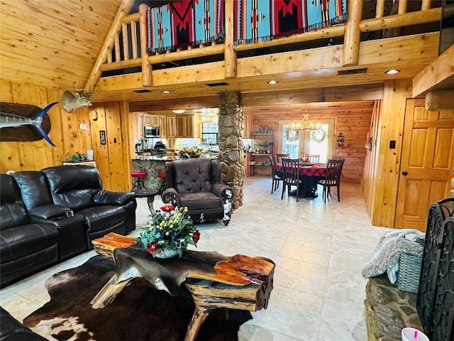637 County Road 4420, Winnsboro, TX 75494 - living area with wood walls, high vaulted ceiling, a chandelier, and wooden ceiling