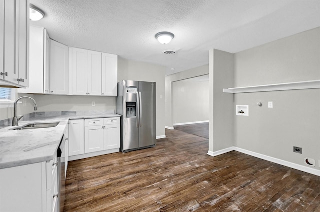 2519 N Hickory St, Sherman, TX 75092 - kitchen with appliances with stainless steel finishes, a sink, white cabinets, dark wood finished floors, and baseboards