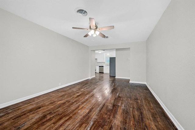 2519 N Hickory St, Sherman, TX 75092 - unfurnished living room with dark wood-type flooring, ceiling fan, and baseboards
