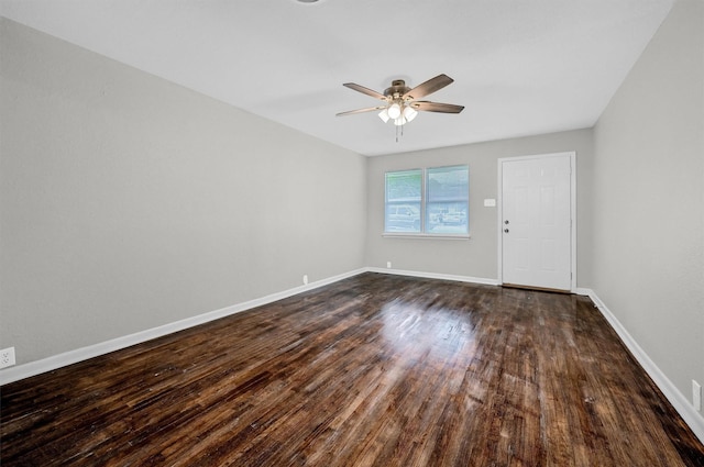 2519 N Hickory St, Sherman, TX 75092 - empty room featuring a ceiling fan, dark wood-style floors, and baseboards
