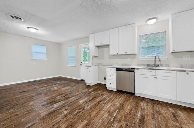 2519 N Hickory St, Sherman, TX 75092 - kitchen featuring dishwasher, a sink, dark wood finished floors, a textured ceiling, and white cabinets