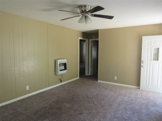 344 Castle Dr, Pottsboro, TX 75076 - unfurnished room with heating unit, ceiling fan, carpet, wood walls, and baseboards