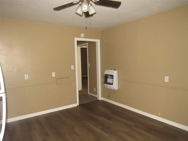 344 Castle Dr, Pottsboro, TX 75076 - empty room with heating unit, dark wood-type flooring, ceiling fan, and baseboards
