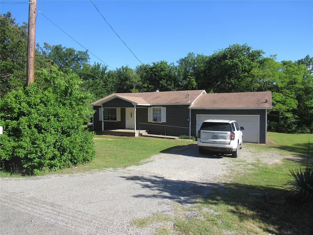 344 Castle Dr, Pottsboro, TX 75076 - ranch-style house with gravel driveway, a front yard, and an attached garage