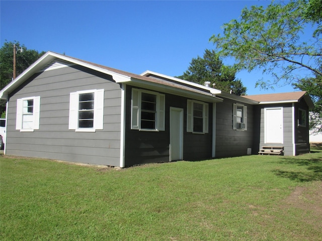 344 Castle Dr, Pottsboro, TX 75076 - view of side of property featuring entry steps, a yard, and cooling unit