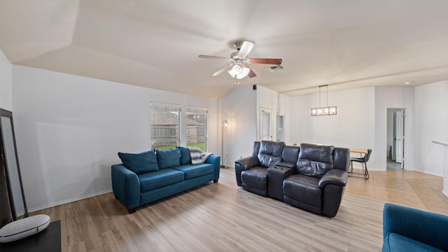 2005 Sterling Gate Dr, Heartland, TX 75126 - living room with a ceiling fan, a chandelier, light wood-style flooring, and baseboards