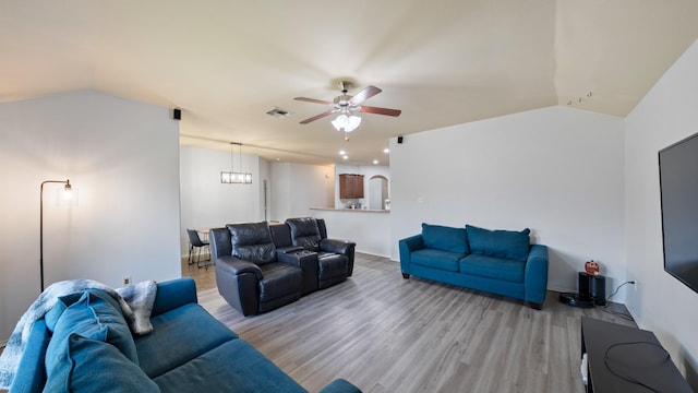 2005 Sterling Gate Dr, Heartland, TX 75126 - living area with ceiling fan, light wood finished floors, vaulted ceiling, baseboards, and a chandelier